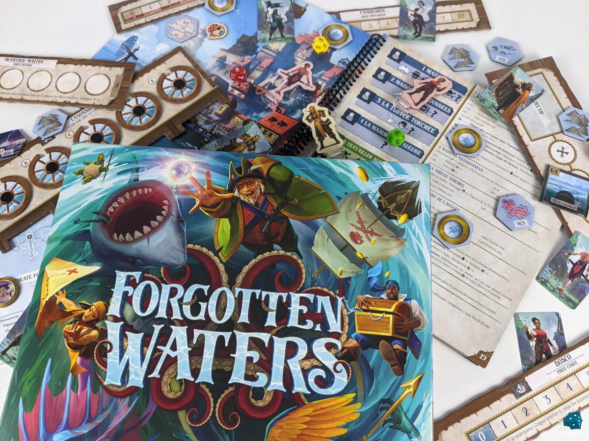 The box lid of the game, showing a maelstrom with pirates, sea creatures, ships and treasure. In the background are some game components (player standees, role tracks, tiles, the location book, etc.