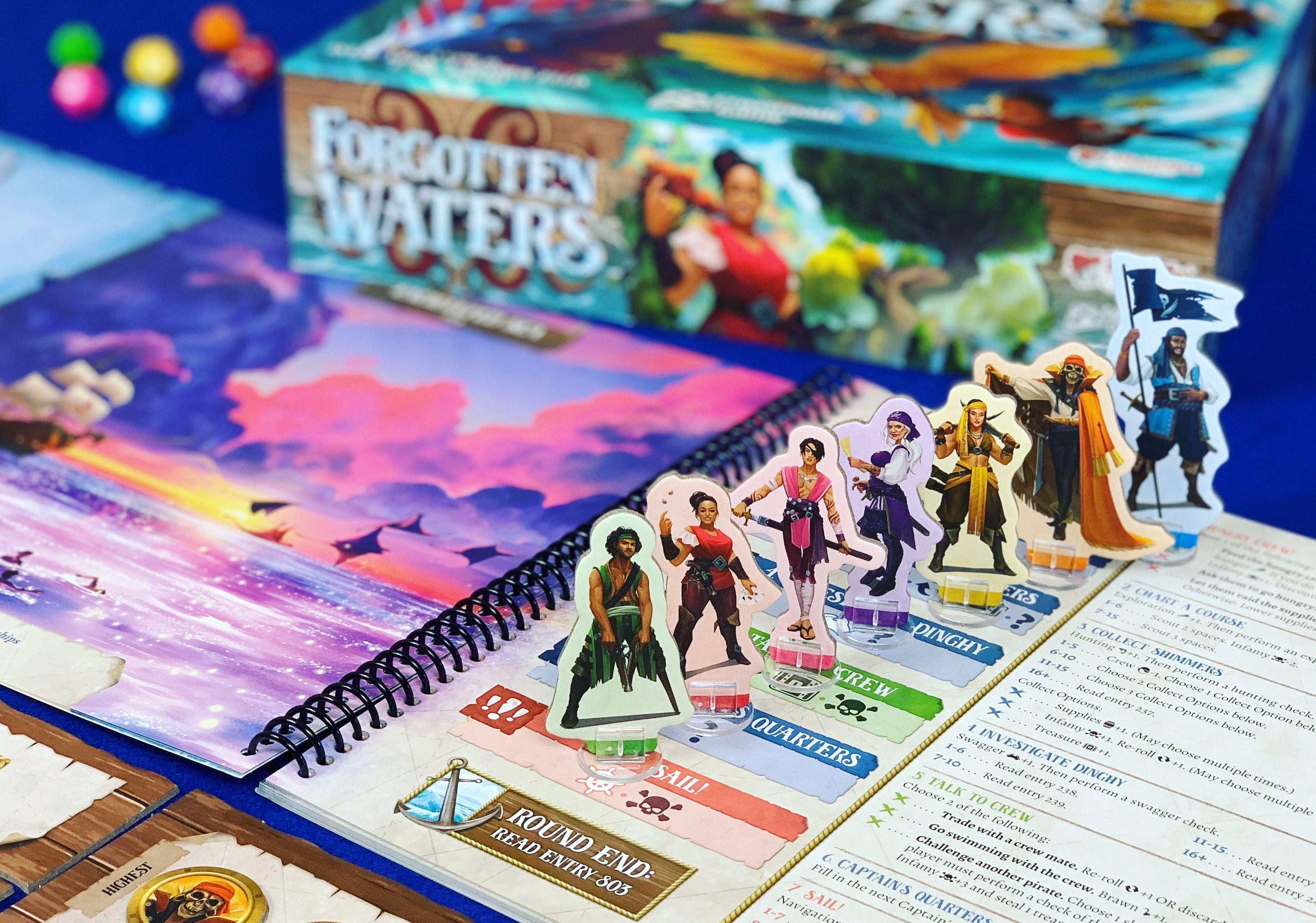 The player standees, a diverse and colourful crew of pirates, on an open page of the location book. The game box is visible in the background.