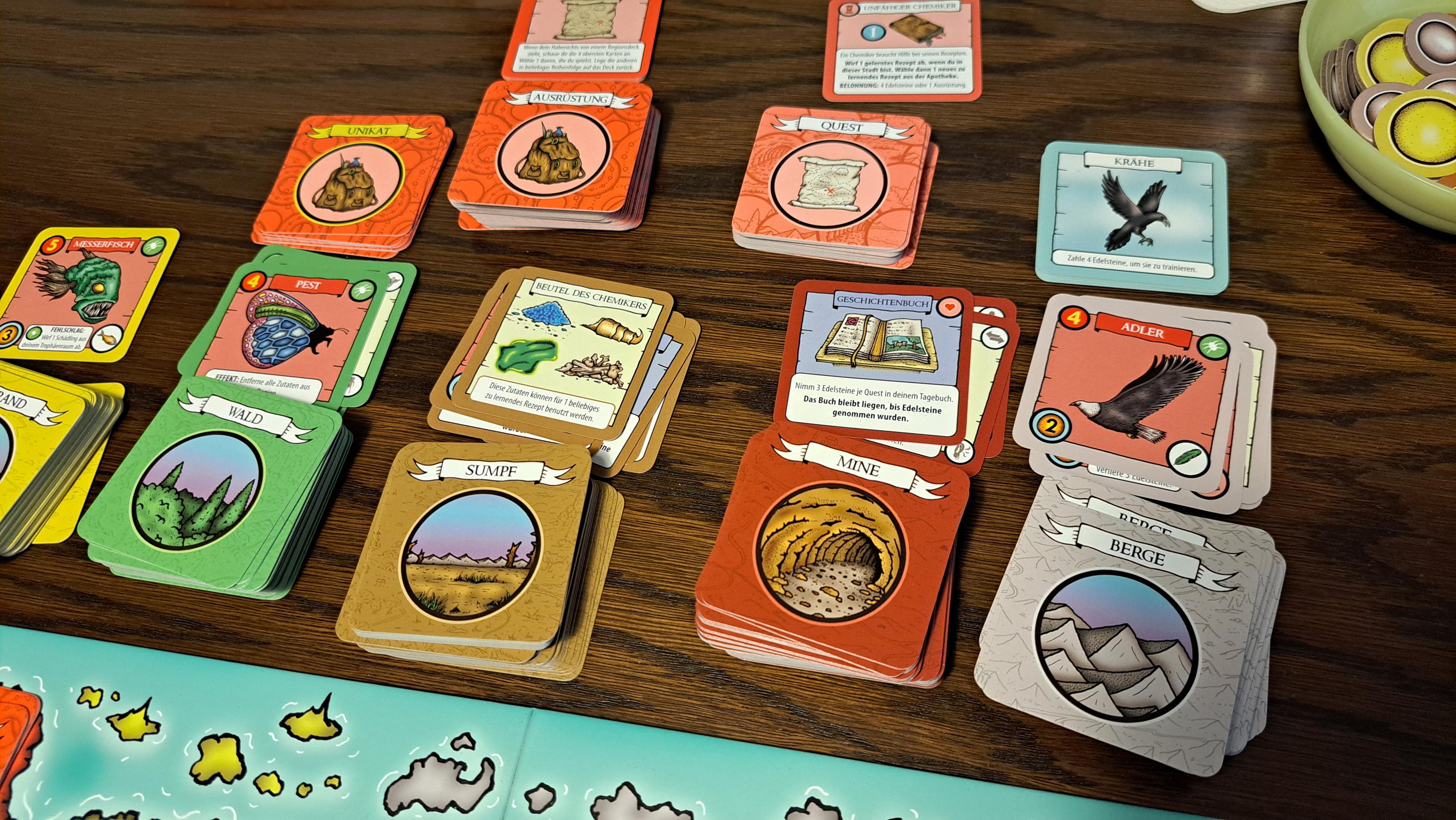 Various stacks of cards for the different terrain types, quests, items, and birds.
